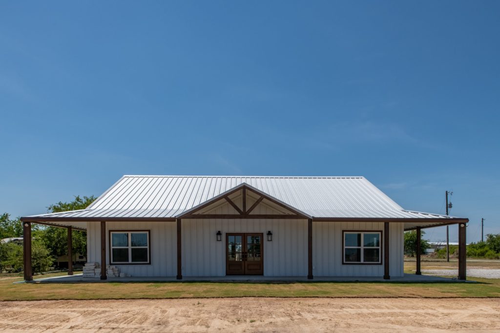 white-barndominium-with-windows